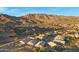 Aerial view of houses and streets in a community with mountain views at 15632 S 6Th St, Phoenix, AZ 85048