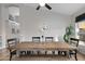 Dining room featuring a rustic farmhouse table and black chairs at 15632 S 6Th St, Phoenix, AZ 85048