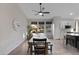 Farmhouse style dining room with large wooden table and seating for six at 15632 S 6Th St, Phoenix, AZ 85048