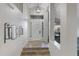 Bright entryway with wood-look flooring and a view to the living room at 15632 S 6Th St, Phoenix, AZ 85048