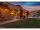 Relaxing patio area with string lights and two rocking chairs at 15632 S 6Th St, Phoenix, AZ 85048