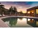 Inviting pool and patio area with mountain views at sunset at 15632 S 6Th St, Phoenix, AZ 85048