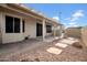 Backyard featuring a covered patio, neutral landscaping, a block wall, and paver stones at 15738 W Clear Canyon Dr, Surprise, AZ 85374