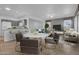 Modern living and dining area featuring stylish furniture and open concept design at 15738 W Clear Canyon Dr, Surprise, AZ 85374