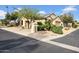 Charming home exterior featuring desert landscaping, a tile roof, and a well-maintained yard at 15738 W Clear Canyon Dr, Surprise, AZ 85374