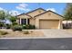 Home exterior showing desert landscaping and a two car garage at 15738 W Clear Canyon Dr, Surprise, AZ 85374