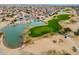 Aerial view of well-manicured golf course with pond and beautiful residential community at 15738 W Clear Canyon Dr, Surprise, AZ 85374