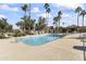 Community pool with plenty of lounge chairs and palm trees at 15801 N 51St St, Scottsdale, AZ 85254