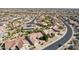 Aerial view of a house with pool in a community at 16220 W Red Rock Dr, Surprise, AZ 85374