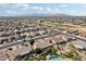 Aerial view of a community with houses, roads, and a golf course at 16220 W Red Rock Dr, Surprise, AZ 85374