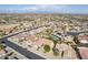 Aerial view of neighborhood with houses and a pool at 16220 W Red Rock Dr, Surprise, AZ 85374