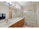 Double sink bathroom with large shower and window at 16220 W Red Rock Dr, Surprise, AZ 85374