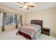 Bedroom with bay window, ceiling fan, and double bed at 16220 W Red Rock Dr, Surprise, AZ 85374