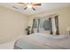 Bedroom with bay window, ceiling fan, and double bed at 16220 W Red Rock Dr, Surprise, AZ 85374