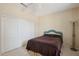 Bedroom with double bed, closet, and floor lamp at 16220 W Red Rock Dr, Surprise, AZ 85374