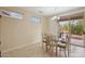 Casual dining area with glass-top table and access to the patio at 16220 W Red Rock Dr, Surprise, AZ 85374