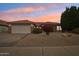 Single-story home with a two-car garage and desert landscaping at 16220 W Red Rock Dr, Surprise, AZ 85374