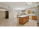 Kitchen boasts an island with ample storage and a breakfast bar at 16220 W Red Rock Dr, Surprise, AZ 85374