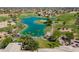 Gorgeous aerial view overlooking the lush green golf course and tranquil turquoise lake at 16639 W Pinchot Ave, Goodyear, AZ 85395