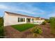 Home with an inground pool, a covered patio, and lush landscaping at 16639 W Pinchot Ave, Goodyear, AZ 85395