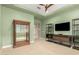 Bedroom with ample light, neutral colors, and wooden shelving at 16639 W Pinchot Ave, Goodyear, AZ 85395