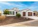 Beautiful single-story home with a two-car garage and drought tolerant landscaping with tasteful stone at 16639 W Pinchot Ave, Goodyear, AZ 85395