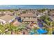 Aerial view of house, pool, and backyard; neighborhood in background at 1811 E Powell Way, Chandler, AZ 85249