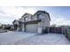 Two-story house with landscaped yard, two-car garage, and a welcoming front porch at 1811 E Powell Way, Chandler, AZ 85249