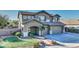 Two story house with landscaped yard and two car garage at 1811 E Powell Way, Chandler, AZ 85249