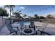 Relaxing backyard oasis with a kidney shaped pool and firepit at 1811 E Powell Way, Chandler, AZ 85249