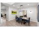 Modern dining area with marble table and six chairs at 18140 N 92Nd St, Scottsdale, AZ 85255