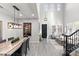 Open dining room features a large marble table and modern light fixture at 18140 N 92Nd St, Scottsdale, AZ 85255