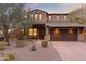 Beautiful two-story home with stone accents and a three-car garage at 18140 N 92Nd St, Scottsdale, AZ 85255