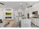 Modern kitchen with white cabinets and a large island at 18140 N 92Nd St, Scottsdale, AZ 85255