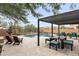 Outdoor patio with pergola, seating, and pool access at 18140 N 92Nd St, Scottsdale, AZ 85255