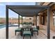 Pergola covered patio with table and chairs near pool at 18140 N 92Nd St, Scottsdale, AZ 85255