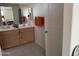 Double vanity bathroom with modern light fixtures at 18225 W Yavapai St, Goodyear, AZ 85338