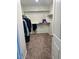 Walk-in closet with shelving and hanging clothes at 18225 W Yavapai St, Goodyear, AZ 85338