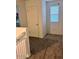 Hallway with carpeted stairs, a window, and a door at 18225 W Yavapai St, Goodyear, AZ 85338