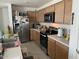 Kitchen with stainless steel appliances and light wood cabinets at 18225 W Yavapai St, Goodyear, AZ 85338