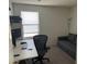 Home office with desk, chair, and comfortable sofa at 18225 W Yavapai St, Goodyear, AZ 85338