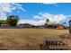 Large backyard with a picnic table and partial house view at 18509 W Bethany Home Rd, Litchfield Park, AZ 85340