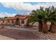 Single-story home with stone accents and a landscaped front yard at 18509 W Bethany Home Rd, Litchfield Park, AZ 85340