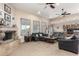 Living room with gray sofas, a coffee table, and a view of the kitchen at 18509 W Bethany Home Rd, Litchfield Park, AZ 85340