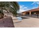 Steps leading to refreshing pool with surrounding patio at 18509 W Bethany Home Rd, Litchfield Park, AZ 85340