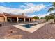 Stunning pool and expansive backyard with a view of the house at 18509 W Bethany Home Rd, Litchfield Park, AZ 85340