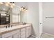 Bathroom boasts double sinks,light wood cabinets and a shower at 19045 N 47Th Cir, Glendale, AZ 85308