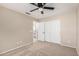 Bedroom featuring a ceiling fan and sliding door closet at 19045 N 47Th Cir, Glendale, AZ 85308