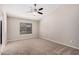 Spacious bedroom with carpeted floor and ceiling fan at 19045 N 47Th Cir, Glendale, AZ 85308