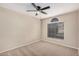 Bright bedroom with ceiling fan and carpeted floor at 19045 N 47Th Cir, Glendale, AZ 85308